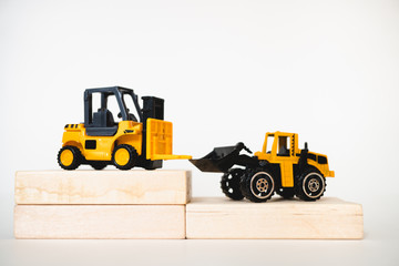 Obraz na płótnie Canvas Miniature construction vehicle using as industrial and construction concept