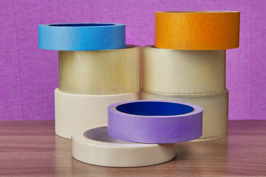Set of transparent self adhesive tape and painting duct tape.