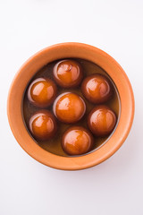 Sweet Gulab Jamun in terracotta bowl