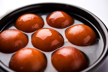Sweet Gulab Jamun in terracotta bowl