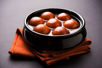 Sweet Gulab Jamun in terracotta bowl