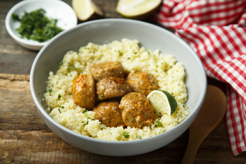 Spice meatballs with vegetable sauce and couscous