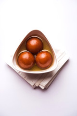 Sweet Gulab Jamun in terracotta bowl
