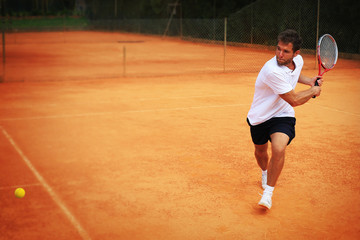 Obraz premium Tennis, player strong punches the ball with a racket