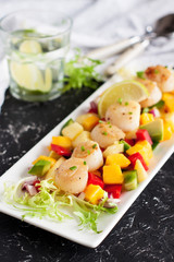 Seared scallops with mango and pineapple salsa
