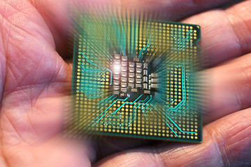 cpu microchip on hand with electronic circuit effects