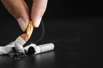World No Tobacco Day, May 31. STOP Smoking. Close up Man hand holding and destroy cigarettes.
