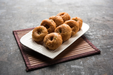 Balushahi sweet food served in a white or golden plate over moody background
