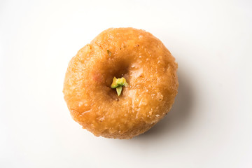 Balushahi sweet food served in a white or golden plate over moody background