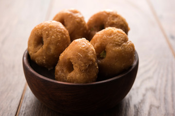 Balushahi sweet food served in a white or golden plate over moody background