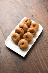Balushahi sweet food served in a white or golden plate over moody background