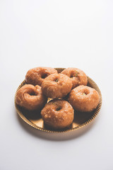 Balushahi sweet food served in a white or golden plate over moody background