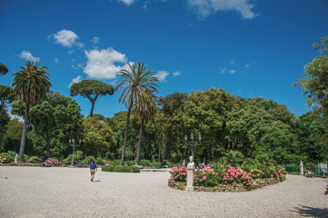 View of square and grove in the Villa Borghese park on a sunny day in Rome, the incredible city of the Ancient Era, known as "The Eternal City". Located in the Lazio region, central Italy