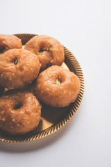 Balushahi sweet food served in a white or golden plate over moody background