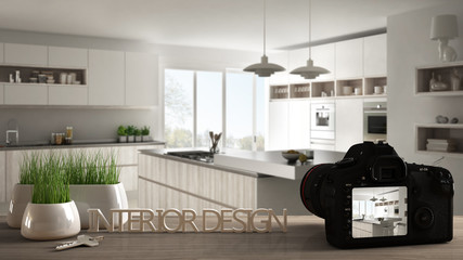Architect photographer designer desktop concept, camera on wooden work desk with screen showing interior design project, blurred scene in the background, modern kitchen idea template