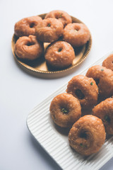 Balushahi sweet food served in a white or golden plate over moody background