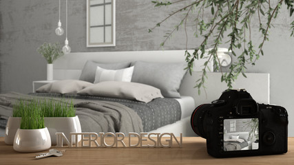 Architect photographer designer desktop concept, camera on wooden work desk with screen showing interior design project, blurred scene in the background, modern bedroom idea template