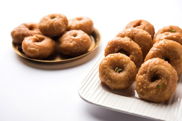 Balushahi sweet food served in a white or golden plate over moody background