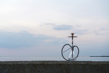 Hookah shisha smoke on beach background