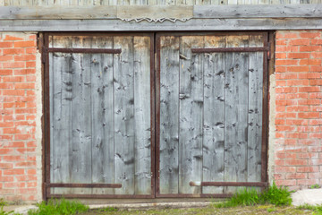 old wooden door in a brick garage
