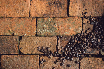 Roasted coffee beans on a brick backgrounds, Morning theme backgrounds, Coffee beans with a copy space.
