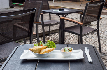 Traditional Arabic dish, sausages with decoration of green salads and cucumbers, with sauce of sauce