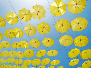 Yellow parasols in the sky