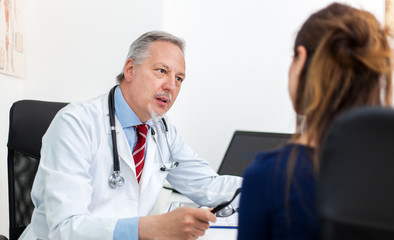 Fototapeta premium Doctor talking to a patient