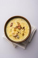 Rice pudding OR Kheer from India called also called Firnee. served in a bowl. Selective focus