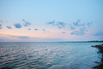 the blue ocean with dull clouds on a lovely sunny day