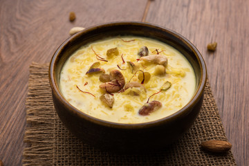 Rice pudding OR Kheer from India called also called Firnee. served in a bowl. Selective focus