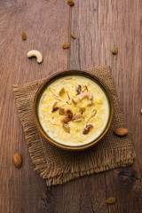 Rice pudding OR Kheer from India called also called Firnee. served in a bowl. Selective focus