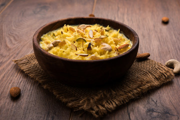 Rice pudding OR Kheer from India called also called Firnee. served in a bowl. Selective focus