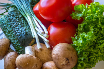 Tomatoes dill mushrooms and tomatoes and salat leaves