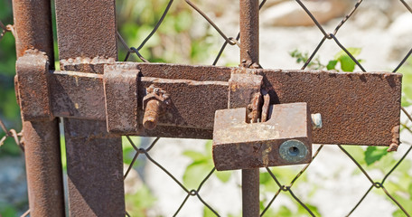 rusty padlock on a door