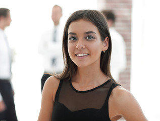 portrait of young business woman on blurred background.