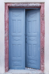 Fototapeta na wymiar Traditional old door of a Greek house at Santorini island