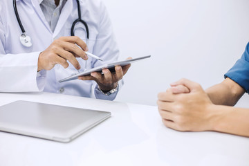 Doctor using digital tablet and ask questions of illness of patients