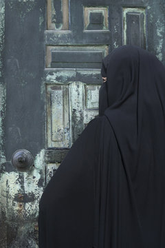 Portrait of a Middle Eastern woman wearing a black Niqab