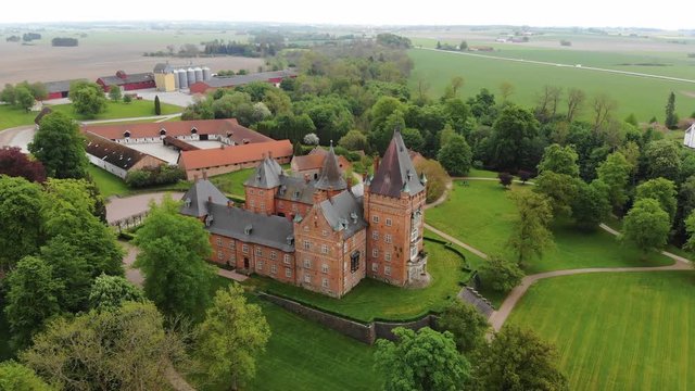 Aerial view of Trollenas Castle in spring, historic building near to Swedish town of Eslov - Scania, Sweden from above, Scandinavia, Europe