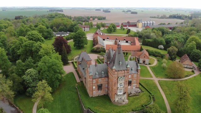 Aerial view of Trollenas Castle in spring, historic building near to Swedish town of Eslov - Scania, Sweden from above, Scandinavia, Europe