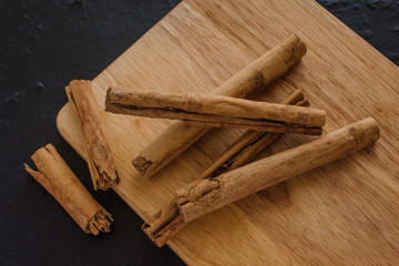cinnamon sticks, on wooden in rustic style