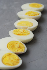 Hard Half Boiled Eggs, Sliced in Halves Food Ingredient Preparation Gray Textured Background
