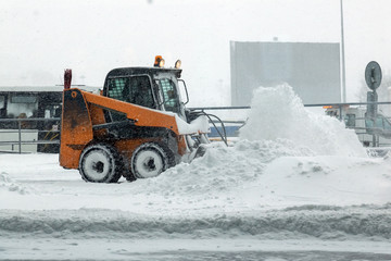 machine for snow removal cleans the road