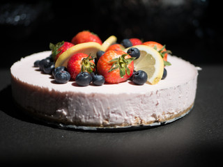 Colorful vegan cheesecake with delicious fruit