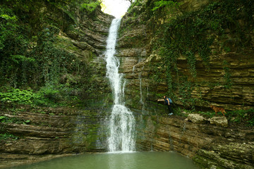 Girl near the waterfall in Sochi