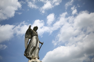 Christianity and Religious Iconography Angel Statue Figurine in a Graveyard