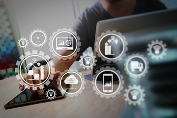 Website designer working digital tablet docking keyboard computer laptop and graphics design diagram on marble desk as concept,light beams effect