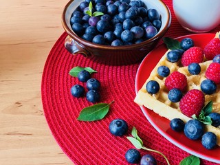 Fresh waffles with garden fruits