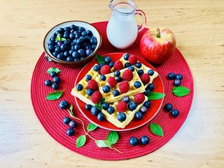 Fresh waffles with garden fruits